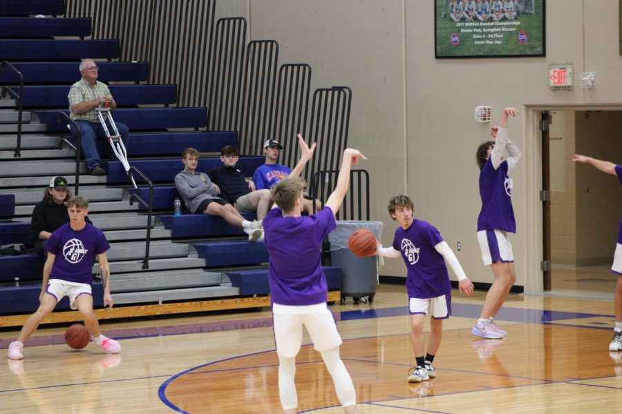 Fair Grove Boys Basketball team during warm-ups at Clever. Pictured left to right Blake Winterburg (11), Brayde Smith (11), and Tyler Barnett (11). (Photo taken by Jackson Anderson)