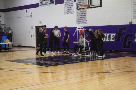 Tim Butler having water poured on him during the courtwarming pep-rally assembly (left to right) Shelly Thornton, Brock Boatwright, Reid Breckner, Tyler Barnett, Spensar Seiger, Tim Butler, Quincy Williams, and Piper Logan. (photo taken by Riley Frazier)