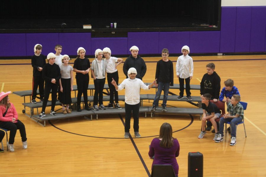 Mrs. Harmons 5th grade class performing on March 3rd, 2023. 
All of the students in the photo. (Photo taken by RayAnn Hupman)
Back row of risers - Reuben Garcia, Carter Goforth
Front row of risers - Regan Hallam, Ila Mackinney, Savannah Sharp, Alyssia Miller, Kassidie Eagleburger, Tristin Coble, Silas Bowman, Ty Morgan
Middle of floor - William Wilson
Chairs of Boys Back - Blake Stanley, Chance Chapman
Chaire of Boys Front - David Arnold, Colton Jones
Girl in Pink - Mia Thomason