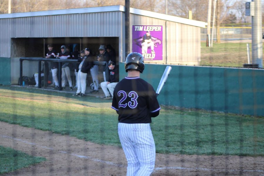 Jackson Martin stepping up to bat at the varsity game against Conway, with the Tim Leeper field sign over his shoulder. 
(photo taken by RayAnn Hupman)