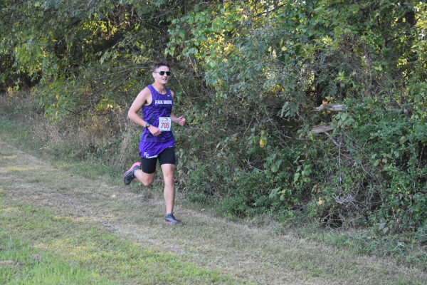 Liam Draper (12) running in the Fair Grove Invitational Cross Country Meet on 9/7. (photo taken by Ayden Teaster)
