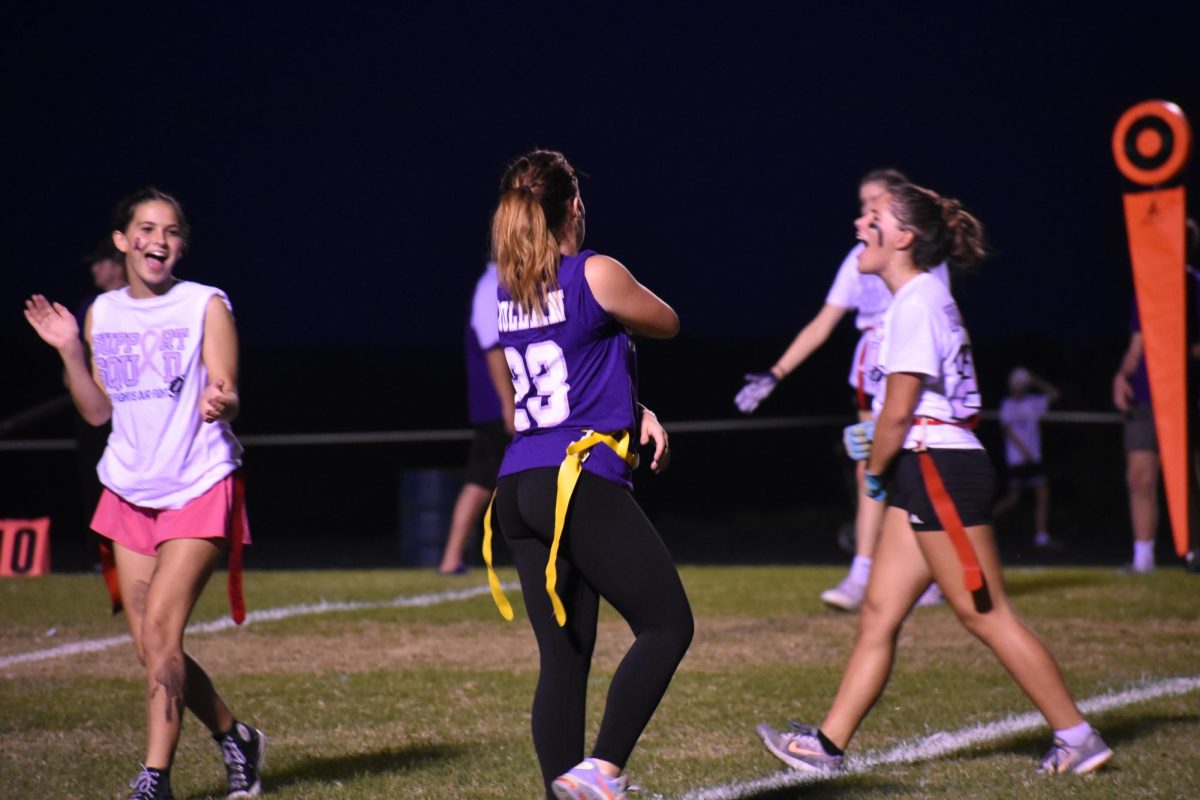 Freshmen Alice McMains, Addison Voorhis and Aubrie Voorhis playing at FBLAs powderpuff game. (Photo taken by FGS News.) 
