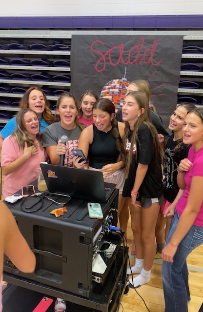 (left to right) Regan Clines, Addison Voorhis, Aubrie Voorhis, Alyssa Snitker, Madi Morris, Lyla Bell, Alice McMains, and Ryanne Crutcher singing karaoke at the SADD kickoff. (photo provided by Camille Boyer) 
