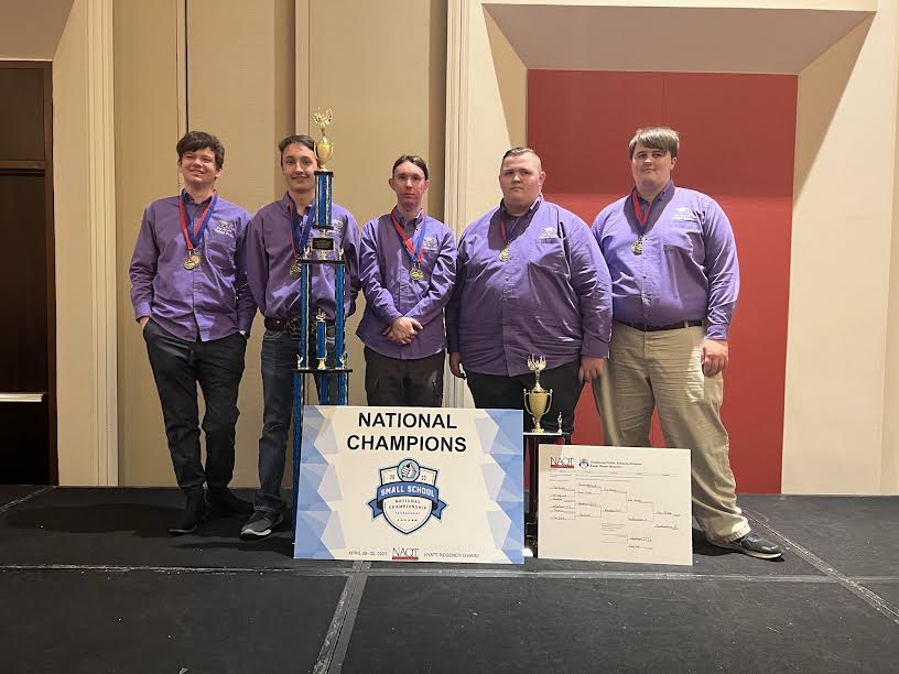 2022-2023 Scholar Bowl Team taking home a national champions trophy.  (left to right): Charlie Harp (12), Braden Booth (2023 graduate), Nathaneal Waggoner (12), Aidyn Owings (10), Christian Allen (2023 graduate). (photo provided by Michelle Wahlquist)