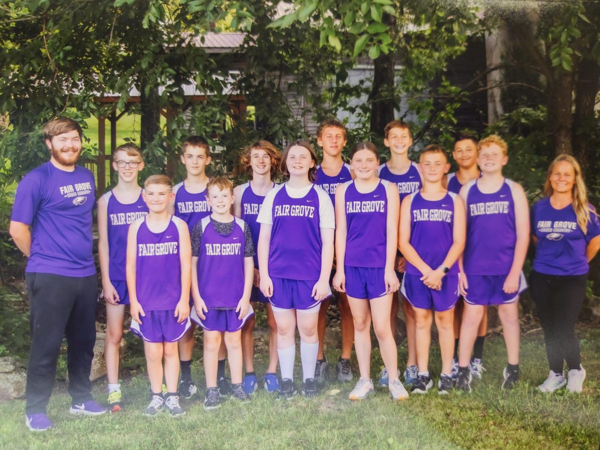 The Fair Grove Middle School Cross Country Team.
Back Row (Left to Right) - Coach Supancic, Ethan Goforth (8), Kendall Wilson (7), Miller Bettis (8), Tyler Whitehead (8), Cinch Dowling (8), Kole Sneed (7), Coach Page
Front Row (Left to Right) - Justin Mecey (7), Tyler Kolb (8), Maggie Johnson (7), Lyla Mullis (7), Benjamin Hofius (8), and Colton Miller (8)