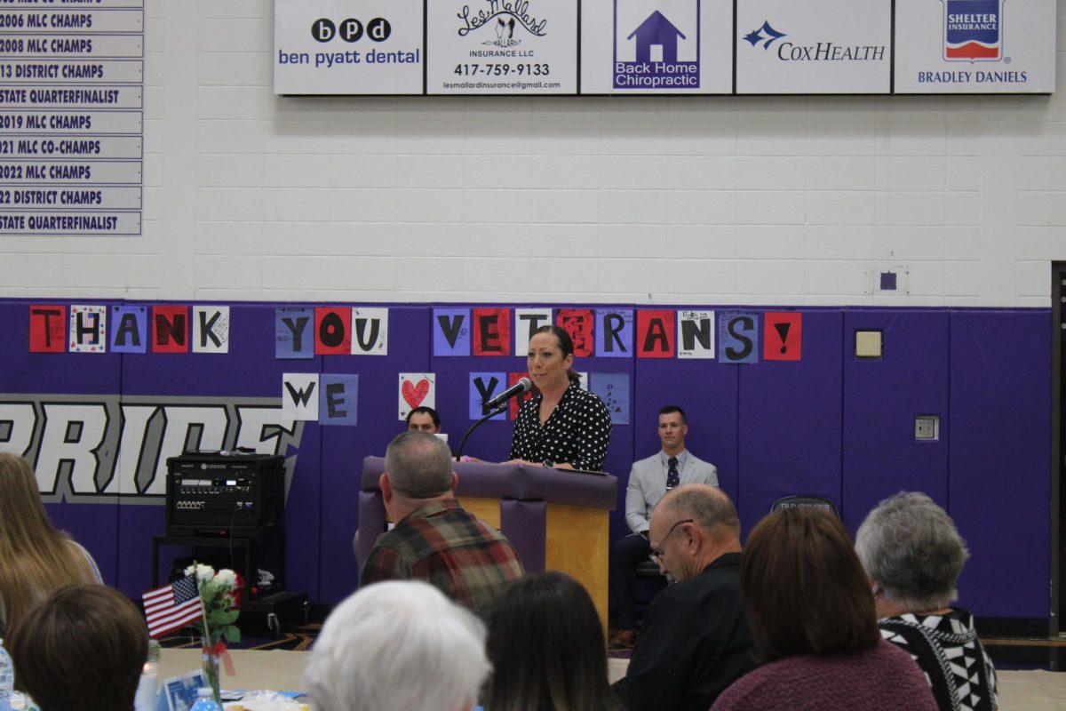 Christina Cantwell giving a speech at the Veterans Day assembly