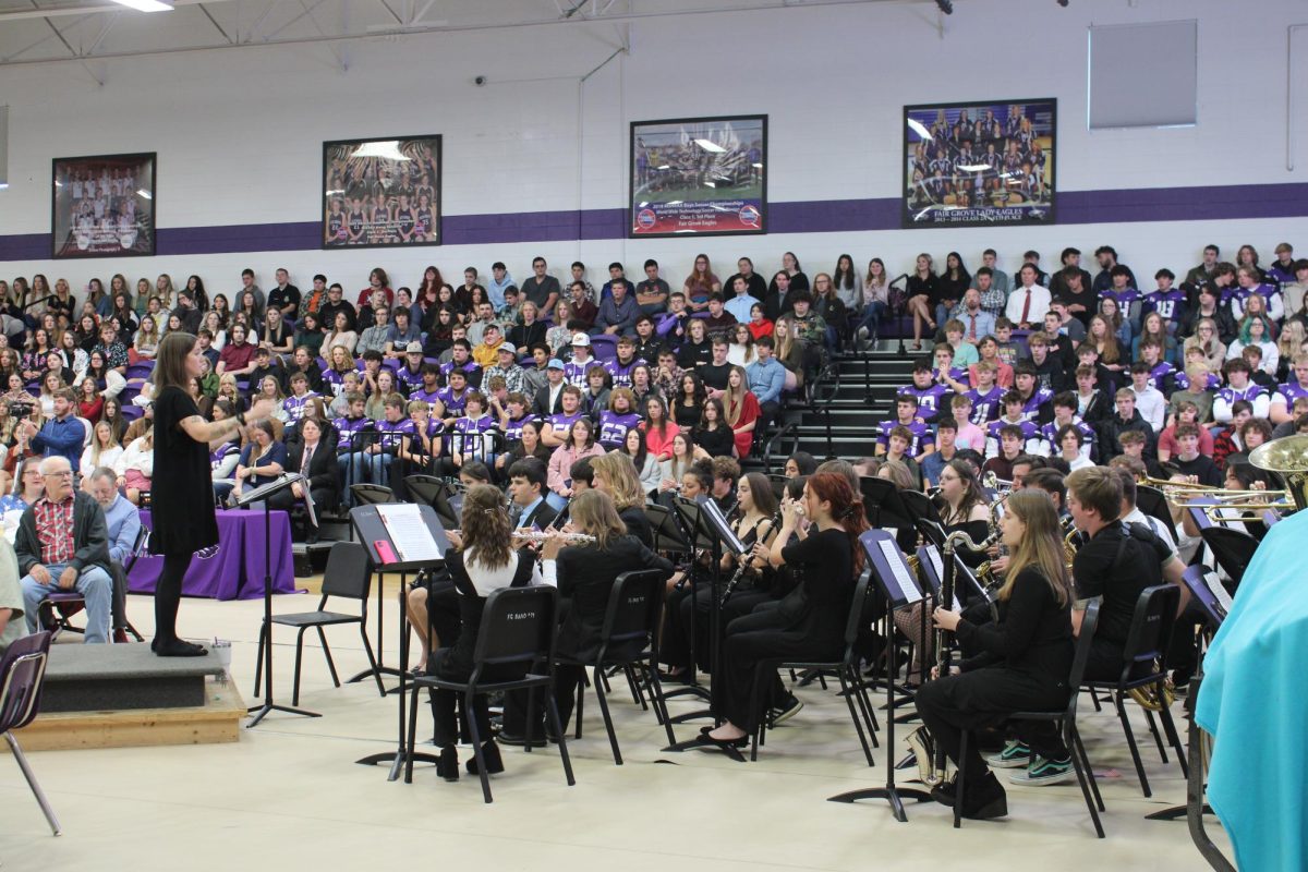 Natalie Palomo leads the band during the 2023 Veterans Day assembly. 