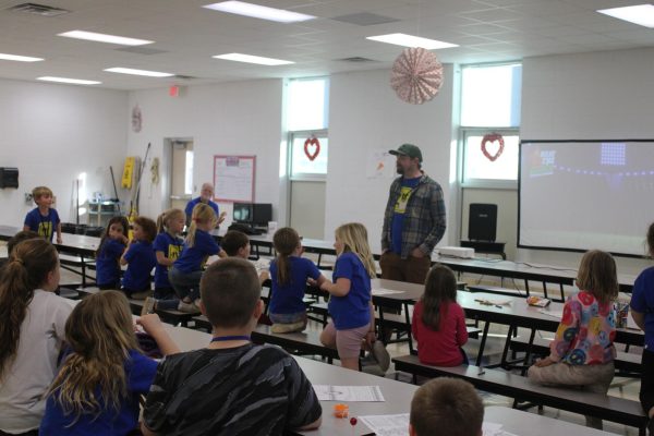 Associate Pastor, Adam Masters, leads a lesson for Fair Grove Elementary students at the Good News Club.