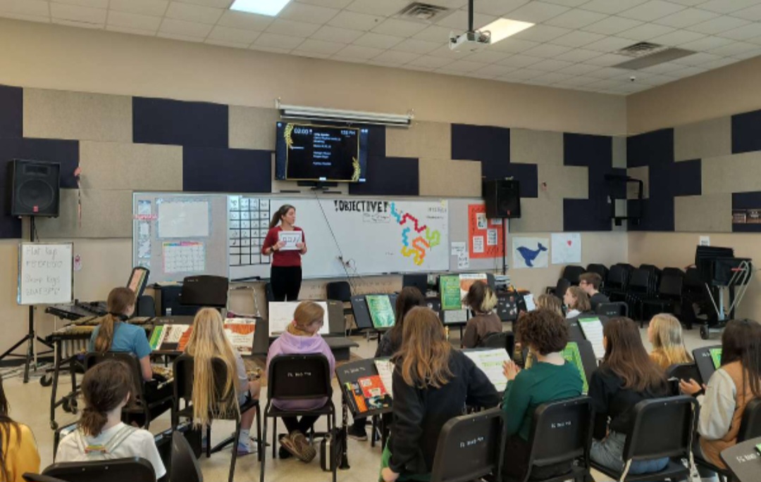 Natalie Palomo teaching her sixth grade band class