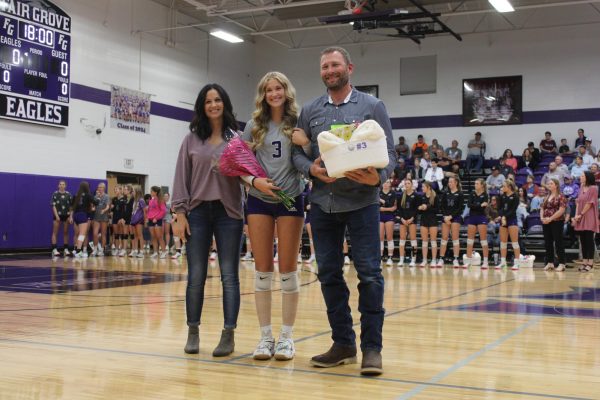 Academic All-State recipient Faith Klindworth being recognized with Mr. and Mrs. Klindworth during volleyball senior night.