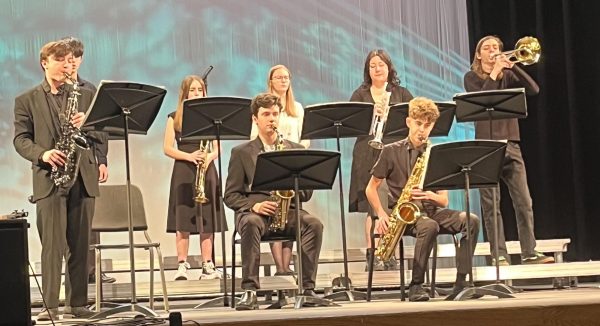 The Jazz band performing their ballet at the Jazz festival. People in the photo from left to right: (back row) Eli Sanders, Harlynn Irvine, Caitlin Cook, Mackenzie Cavin, Lee Van Cleave, (front row) Ayden Teaster, Collin Emery, Wyatt Barber
