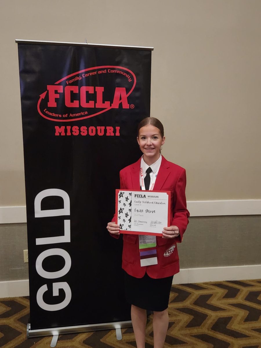 Riley Frazier (11) after receiving a certificate stating that she qualified for nationals.