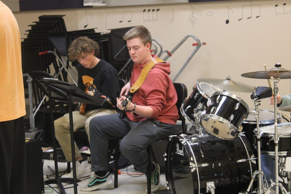 Eli Sanders, Gavin Brock, and Waylon Wright participating in afterschool Jazz Band practice. 