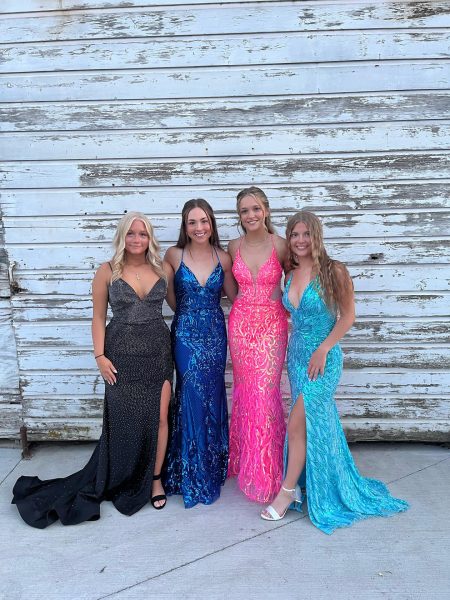 (From left to right) Seniors, Lindy Sutherland, Savannah Ipock, Taylor Green, and Evyn Jones, taking photos before their last Prom.