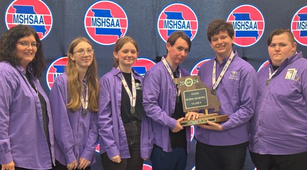 The 2024 Scholar Bowl team took second place at the MSHSAA (Missouri State High School Athletics Association) state tournament held April 4, 2024.  Pictured from left are Coach Michelle Wahlquist, Madison Crews (9), Aiden McClinton(9), Nate Waggoner (12) , Charlie Harp (12), and Aidyn Owings.