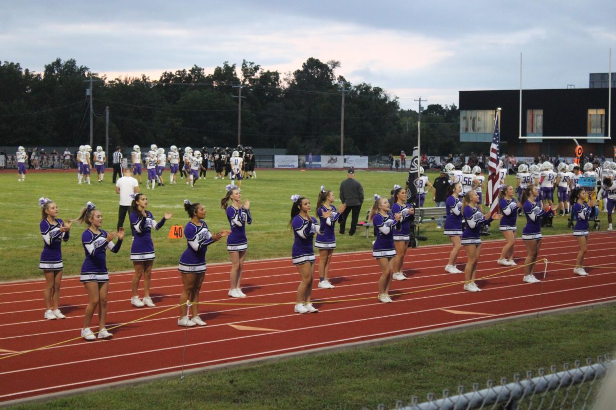  The Fair Grove Cheer Team cheering on the sidelines for the Fair Grove Football Team at a game at the Buffalo Football Field on September 13th. 
Photo includes (from left to right): Lillie Arnold (9), Elizabeth Taylor (11), Alice McMains (10), Eden Lair (11), Maryah Wisely (9), Brooklyn Mauldin
(12), Caydence Drake (9), Neveah Lahey (12), Aubrie Voorhis (10),
Reese Wells (12), Zoe Baxter (9), Addison Voorhis (10), Desiree Labaw
(11), Avery Austin (10).