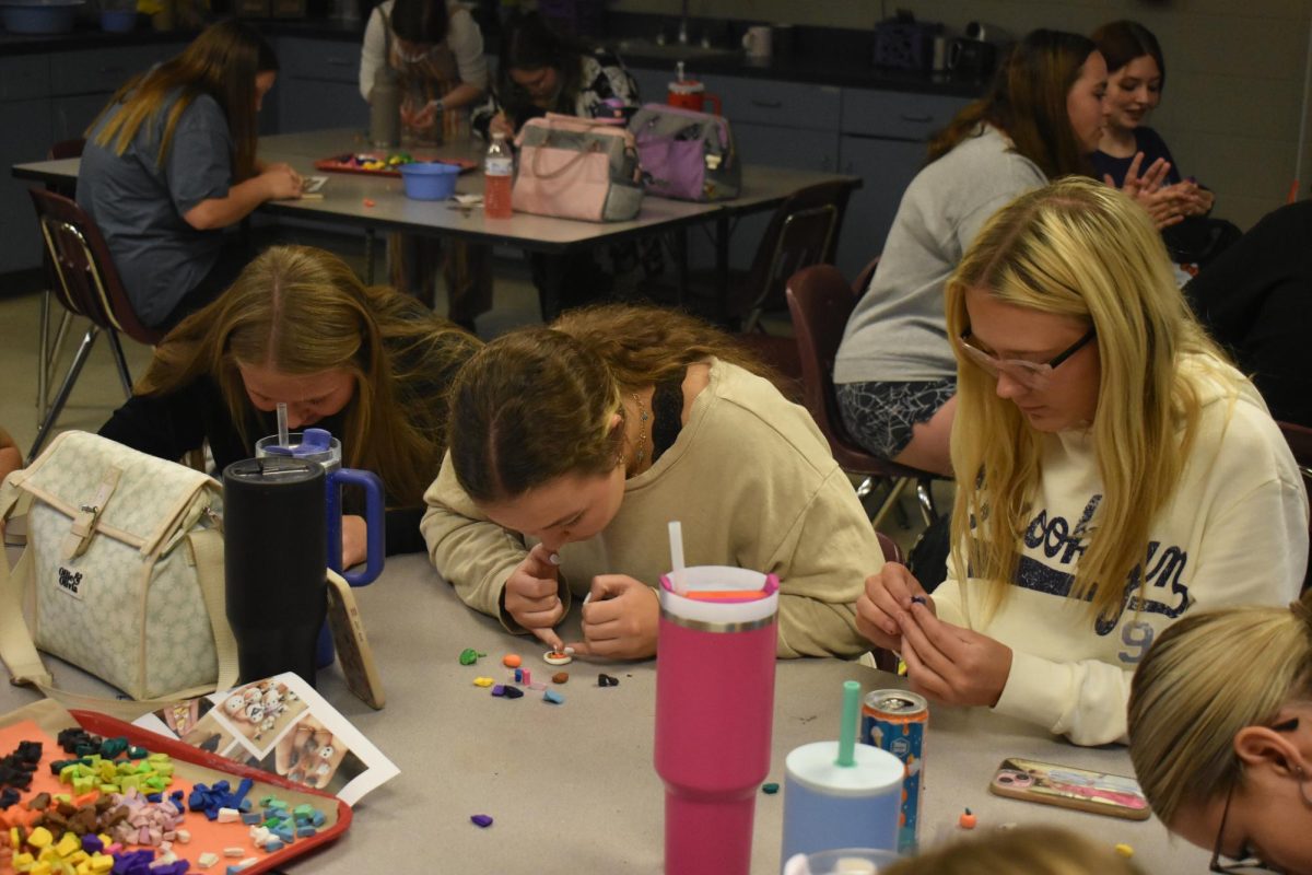 Art Club's members work on their first project during their meeting on October 9th, 2024. (From left to right: Olivia Phelps, Sophia Brumfield, and Brooklyn Williams.) 
