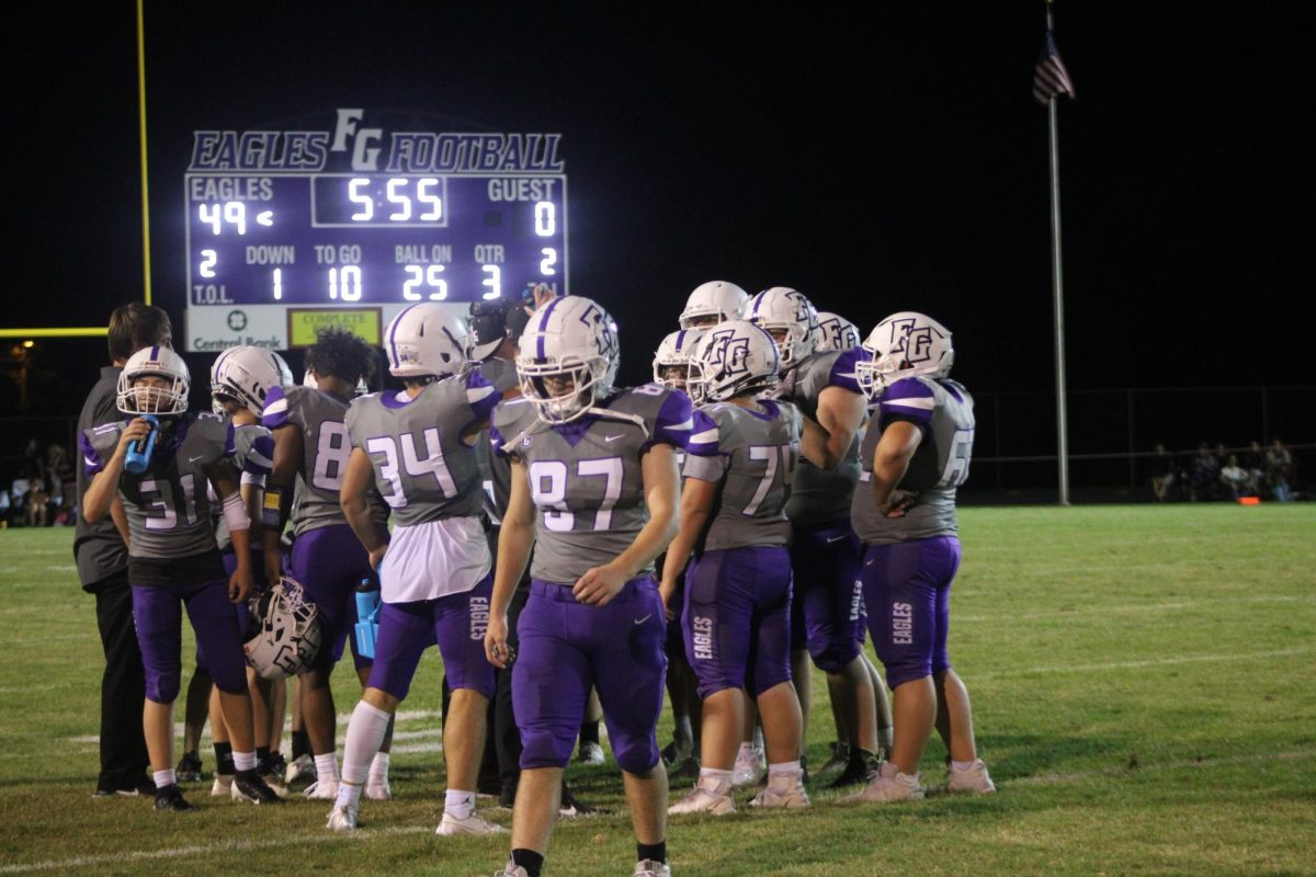 The Fair Grove Football Team huddles on the home field, winning their second game of the season. Making the score 49/0 against Central. This photo was taken by Erica Feith.