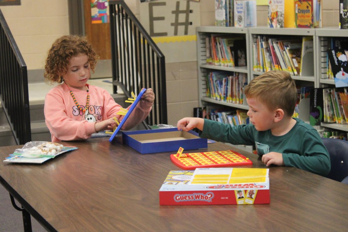 Blayke Buffington and Bo Buffington  utilizing the board game station put on by the Fourth Grade Department. 
