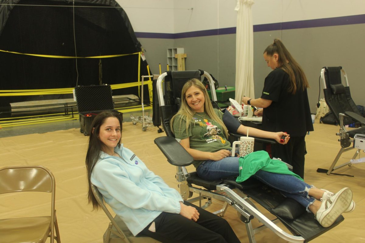  Mrs. Overstreest getting her blood drawn at the Fair Grove FEMA building for the FBLA/DECA blood drive. (In photo: Skyelar Farthing, Cayse Overstreet) Photo taken by Addyson Nunley