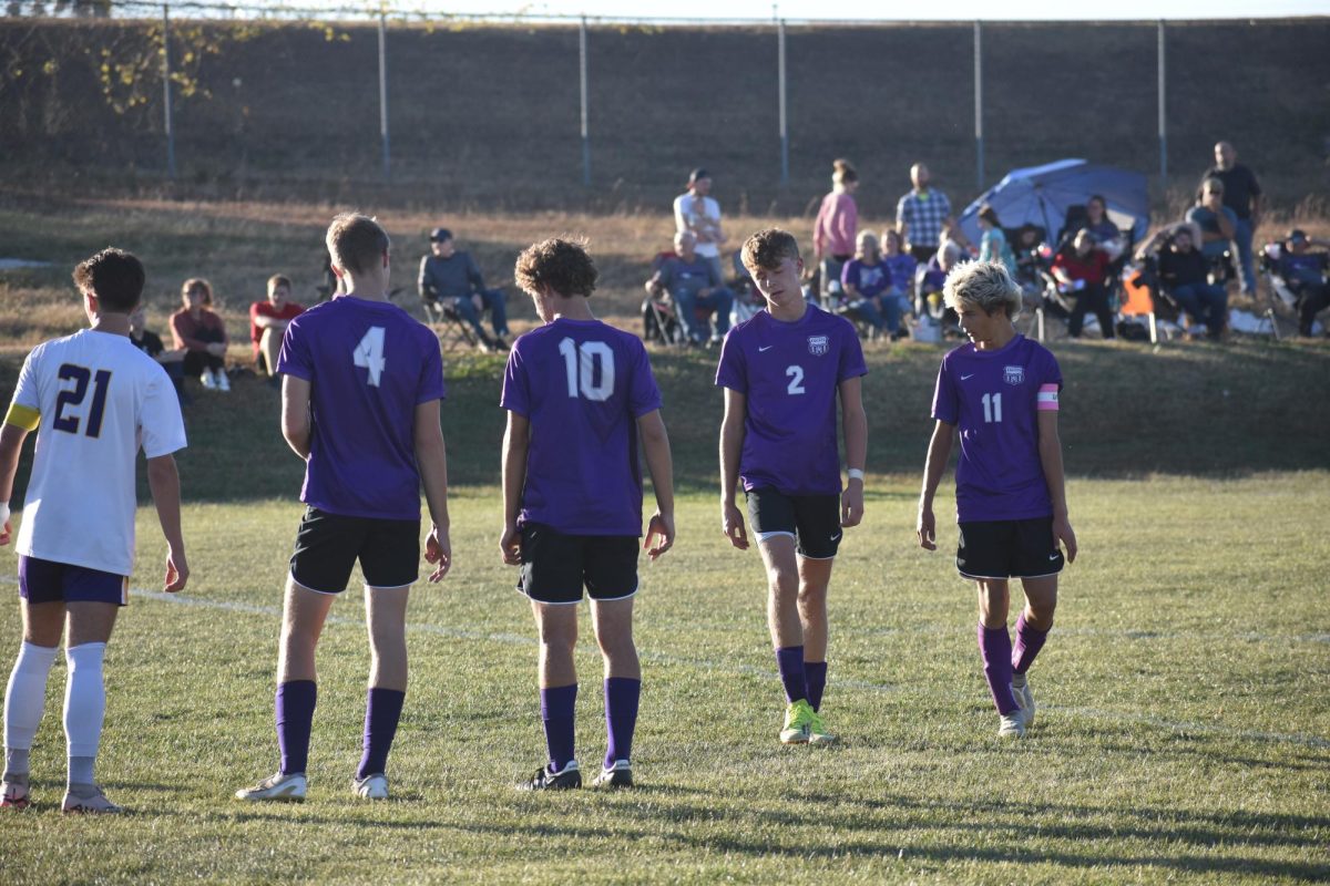 Players, senior Kellan Kirkpatrick (4), freshman, Tyler Whitehead (10), junior, Grant Fuller (2), and sophomore, Jacob Shirtz (11), getting into position on Senior Night against Thomas Jefferson Independent on 10/22.