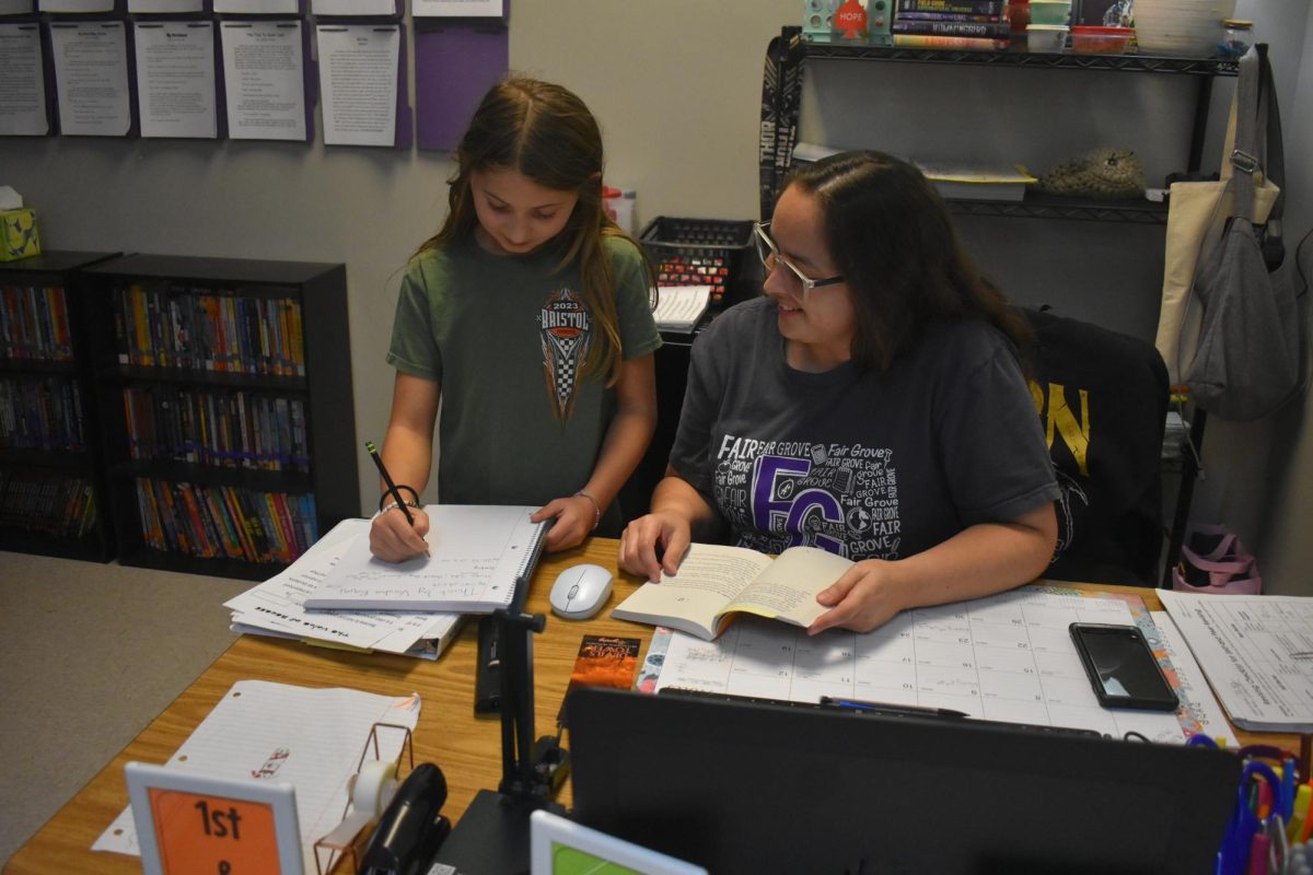 Manda Hicks, new 5th grade English teacher, working on some Mark Twain questions with Brylee Ballinger(5). 