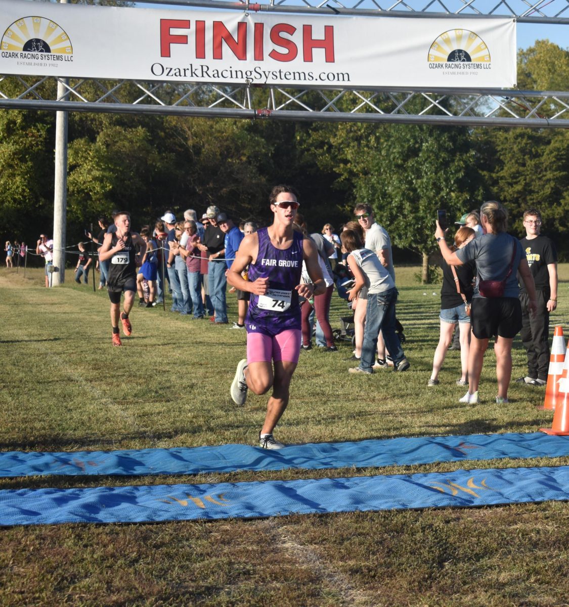 Nolen Geitz (12) finishing the race at the home cross country meet. 