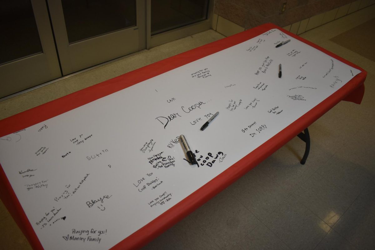 A table with a letter that people can sign for Cooper Roy on it.