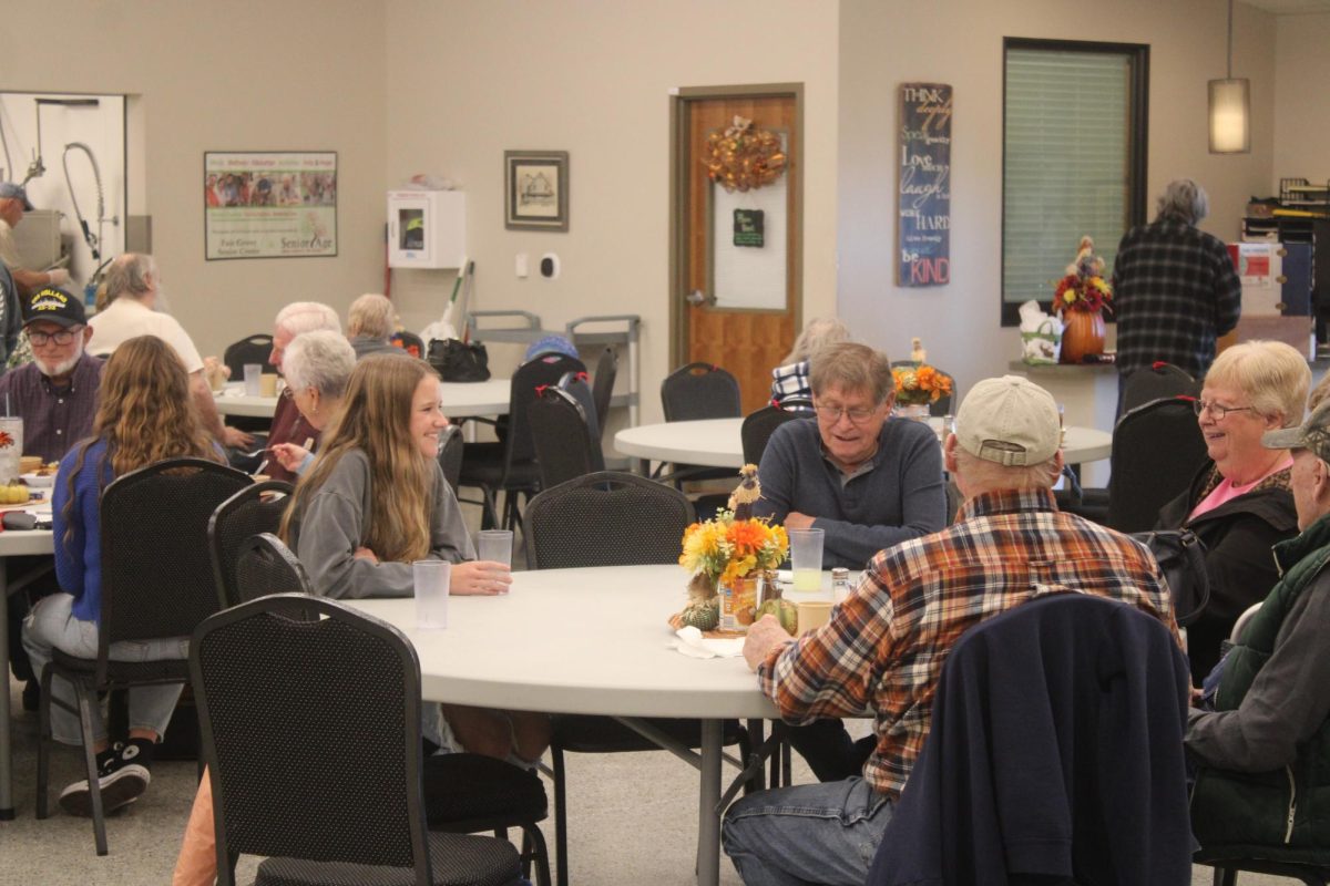 Brenna Boatwright (11) speaking with senior citizens on November 20th, 2024 at the Fair Grove Senior Center