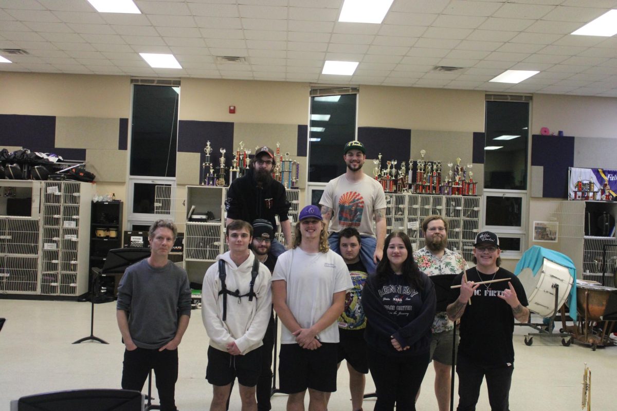 Alumni who previously went to Fair Grove Schools and were involved with the Fair Grove Band taking a photo for Alumni Night.(Featured standing left to right starting in the front row is JP Chapman, Liam Draper, Seth Hardison, Mackenzie Cavin, and Brendan Ferguson. Featured standing left to right in the second row is Nate Brigman, Calvin Zuch, and Elijah Daugherty. Above from left to right is Alex Bates, and Mitch Van Cleave.)