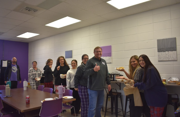 Caption: High school teachers gather to celebrate thanksgiving with a faculty potluck luncheon. Pictured from left to right, Mr. Florez,  Ms. Lindsay, Mrs. Dunning, Ms. Beller, Miss Weaver, Mrs. Small, Mr.Faubion, Mrs. Overstreet, and Mrs. Brown.