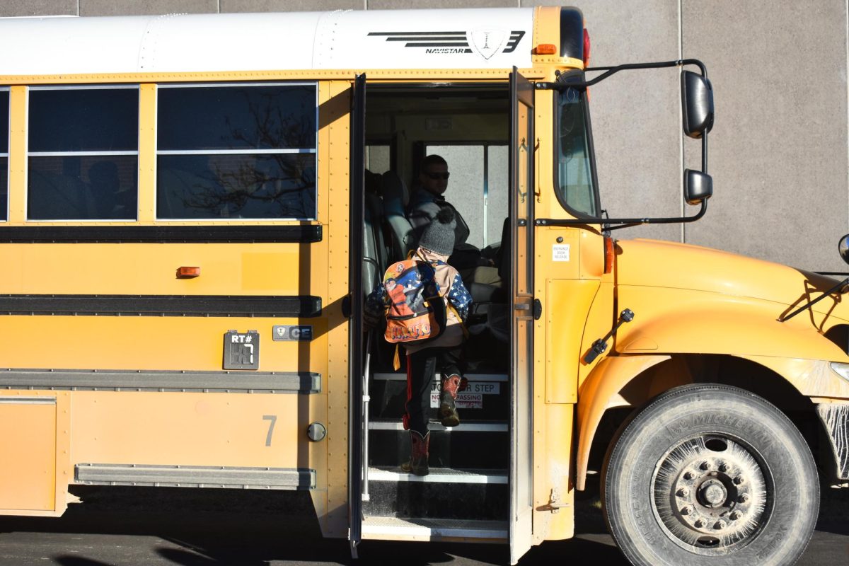 Fair Grove elementary students walking the bus after school onto Brendan Carroll's (driver) bus. 