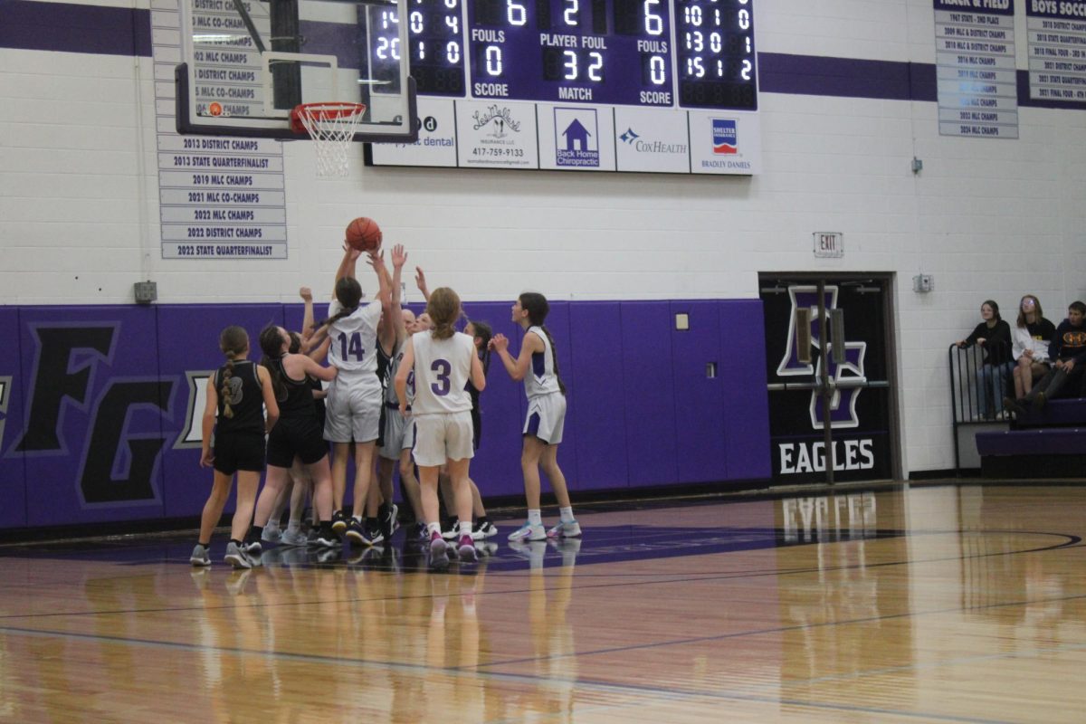 Fair Grove Girls basketball huddled together before a game against Rock Bridge on 12/20 at home. 