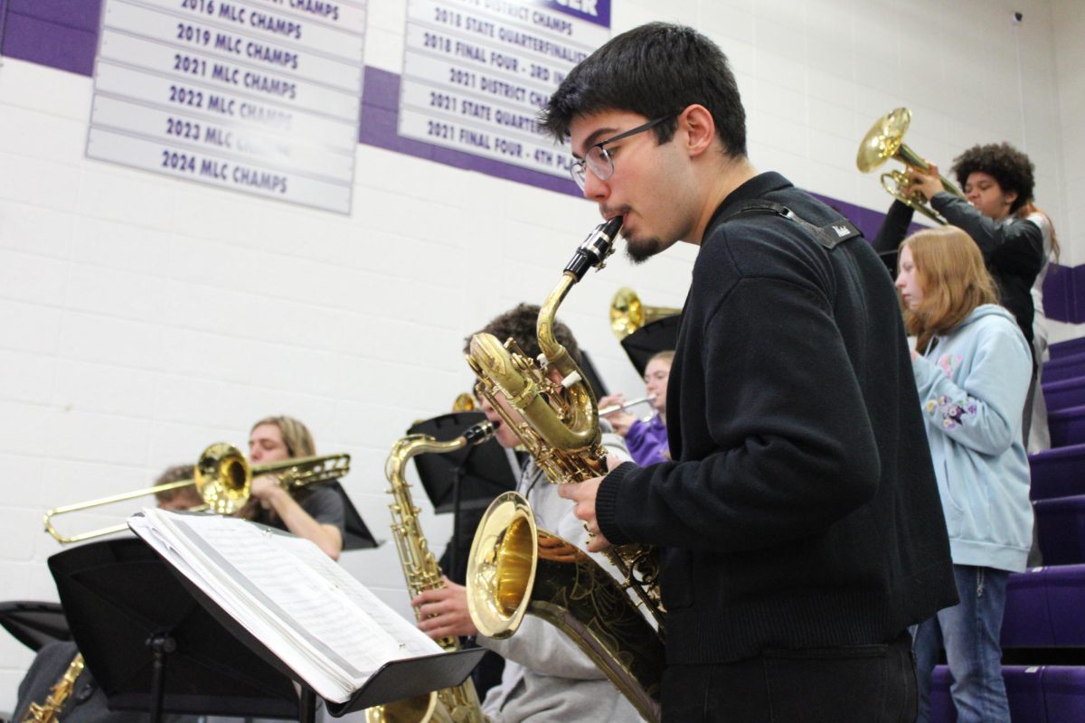 Keith Nolan (12) playing his baritone saxophone at the Fair Grove High School pep assembly.