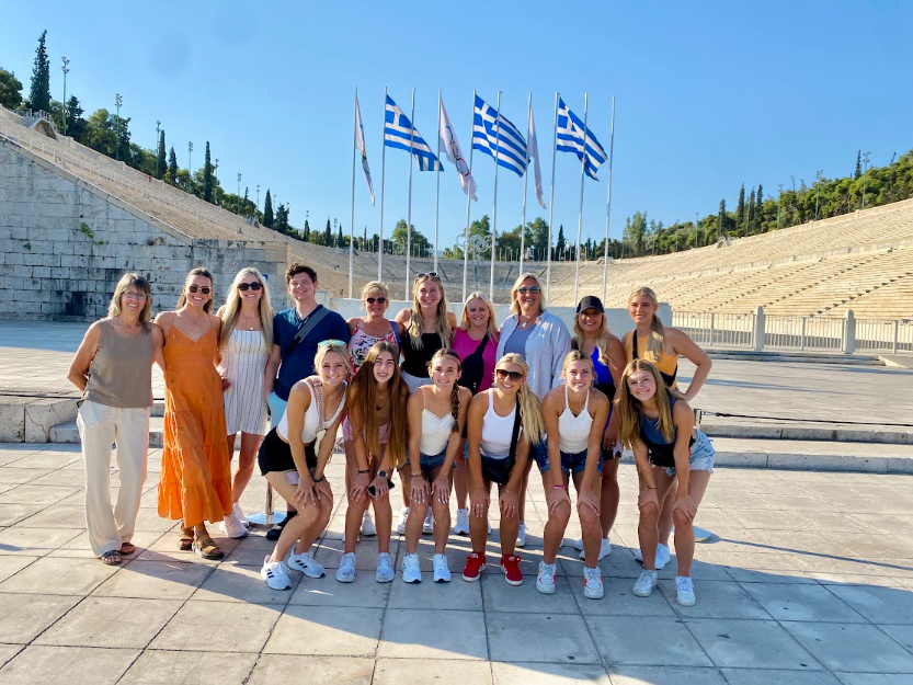 Fair Grove High School Culture Club posing at the Panathenaic Stadium in Athens, Greece during their trip in July 2024. From right to left and top to bottom: Susie Burnett, Lacey March, Shelley Thornton, Charlie Harp, Amy Bell, Shea Skouby, Rhonda Perryman, Christy Skouby, Taylor Bell, Brooke Daniels, Lyla Bell, Allie Sechler, Gracie Crandall, Ashton Bell, Emaley Stallings