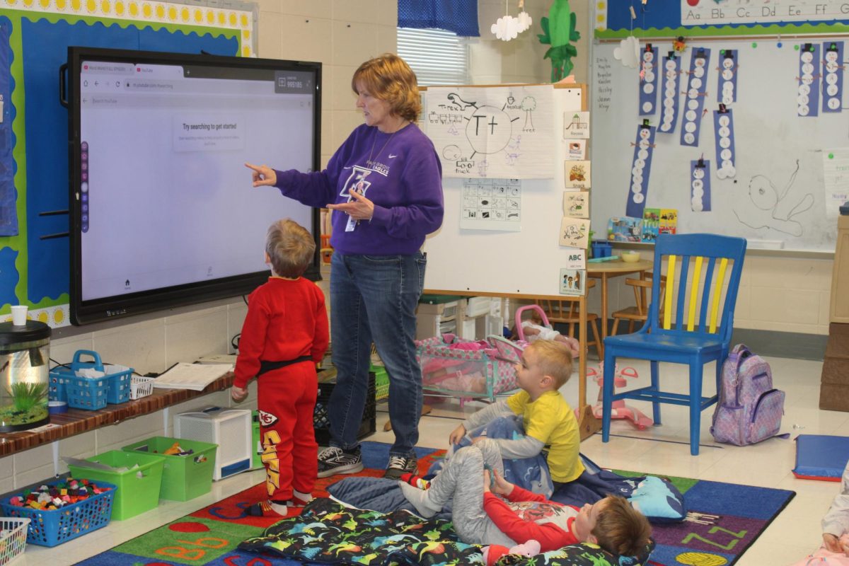 Kim Boatwright, pre-kindergarten teacher at Fair Grove Elementary, teaching her students, Maddox Sechler (PK), Kayson Coonis (PK), and Braxton Hughes (PK)