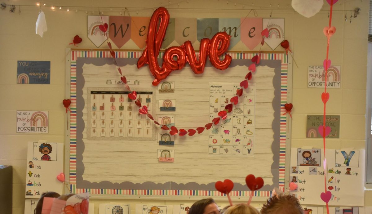 An elementary white board decorated for the class' Valentine's Day party in 2022. 