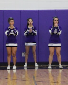 High school cheerleaders Eden Lair (11), Brooklyn Mauldin (12), Alice McMains (10) at the varsity boy's basketball game against Link. Each of them helped run and coach the Jr. Cheer Camp.