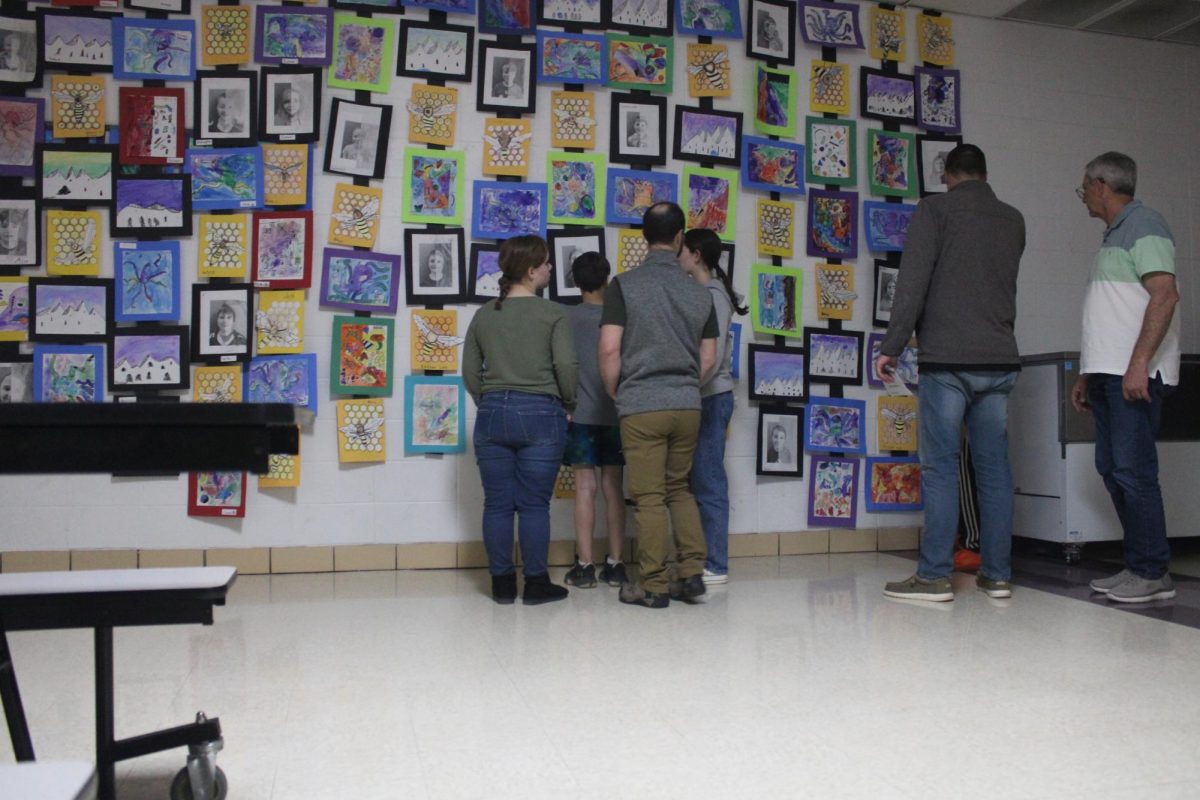 In this photo, are the parents and family who came to view all the artwork their 4th graders had created. This photo was taken during the art show on April 27th.
