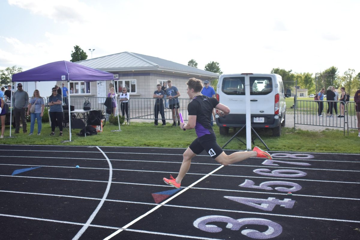 Carson Trussell (11) finishing out the boys relay at the Fair Grove Home Track Meet.