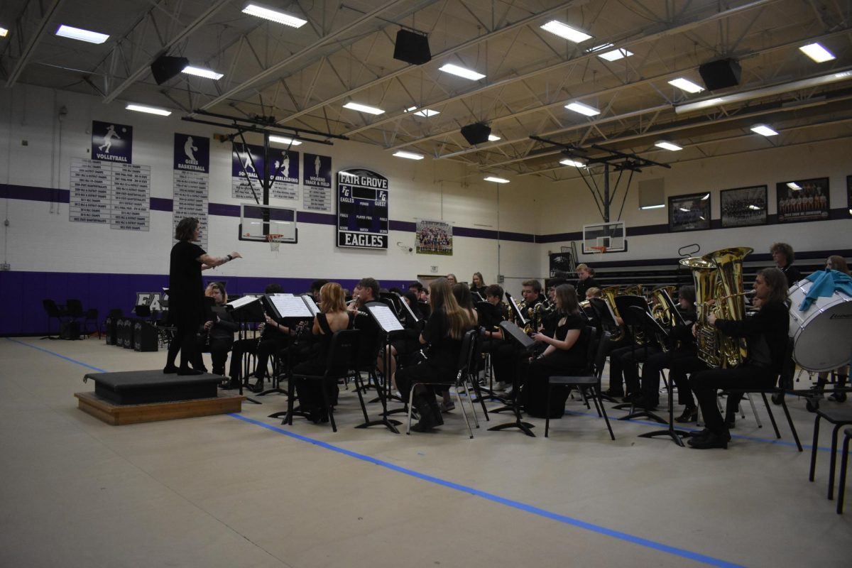 Natalie Palomo instructing the High School Band during their spring concert on Friday, May 2nd. 