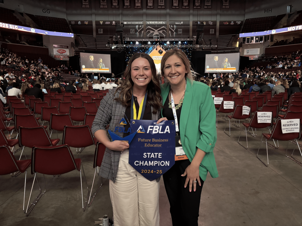 Junior Addyson Nunley with FBLA co sponsor Cayse Overstreet after winning first place in the Future Business Educator event. From left to right: Addyson Nunley (11), Cayse Overstreet
