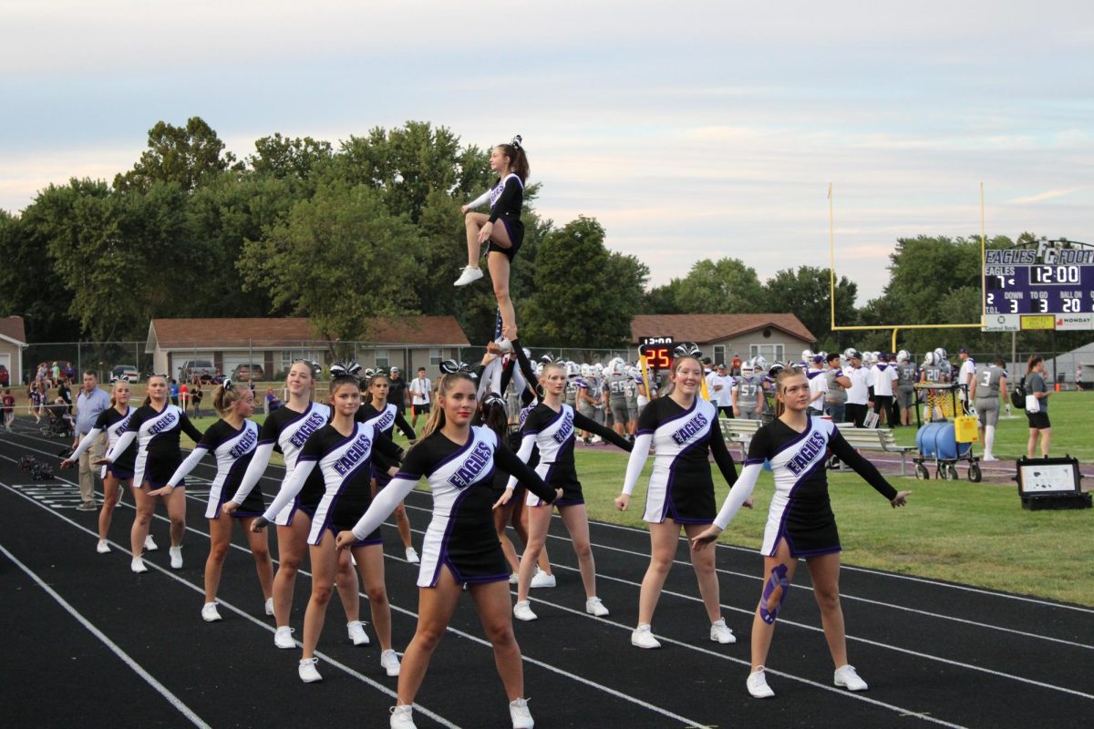 The 2025 cheer team stunting freshman Julia Akin during the football game against Mountain Grove. They will be competing on October 4th at regionals. Front Row: Aubrie Voorhis (11), Avary Austin (11), Desiree Pollock (12), Elizabeth Taylor (12), Taylor Wisely (12), Lillie Arnold (10). Back Row: Caydence Drake (10), Zoe Baxter (10), Maryah Wisely (10), Alice McMains (11). Top Row: Julia Akin (9).