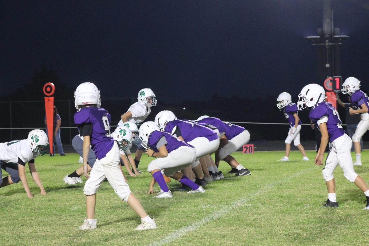 Fair Grove's Middle School Football Team lining up for offense in their game against Catholic in their 2024 season. 