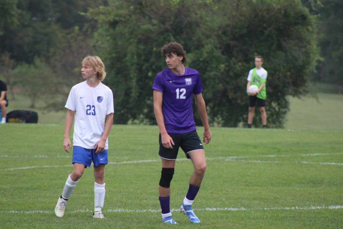 Junior, Finnegan Harp wearing #12 stays locked in during a tense moment of play vs Marshfield, showing his leadership on the field. The team's current season record is 4-2-1.