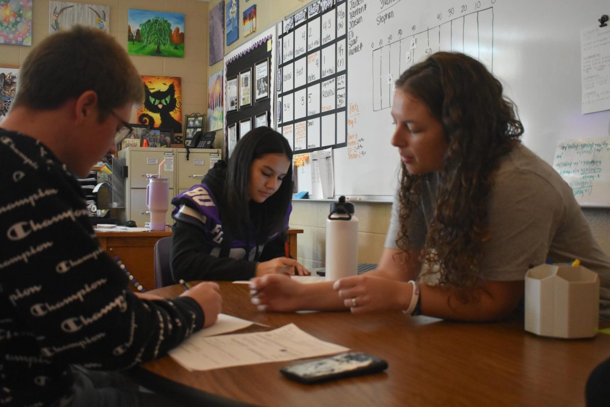 Susanne Feldman, the Fair Grove Algebra 1, Pre Algebra and Calculus teacher helping students (left to right) Montana Conklin (9) and Presley Mauldin (9). Homework Academy is available every Tuesday, Wednesday and Thursday during the school week. 
