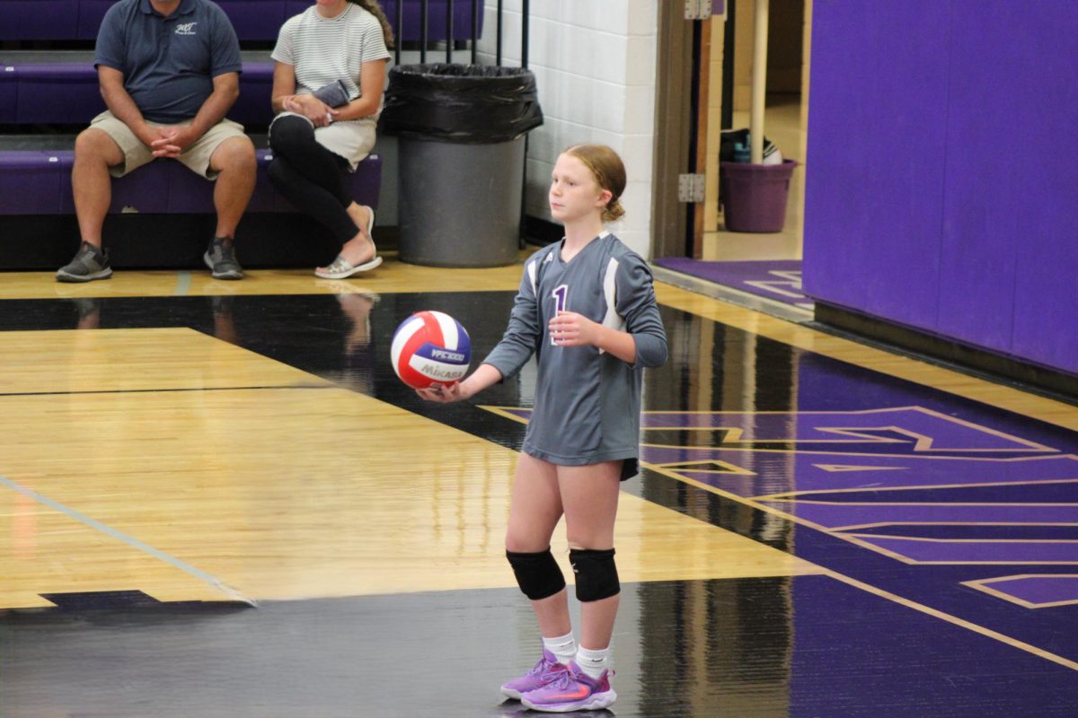 Addison Miller preparing to serve for the 8th grade girls volleyball A team against Strafford on September 24th. 