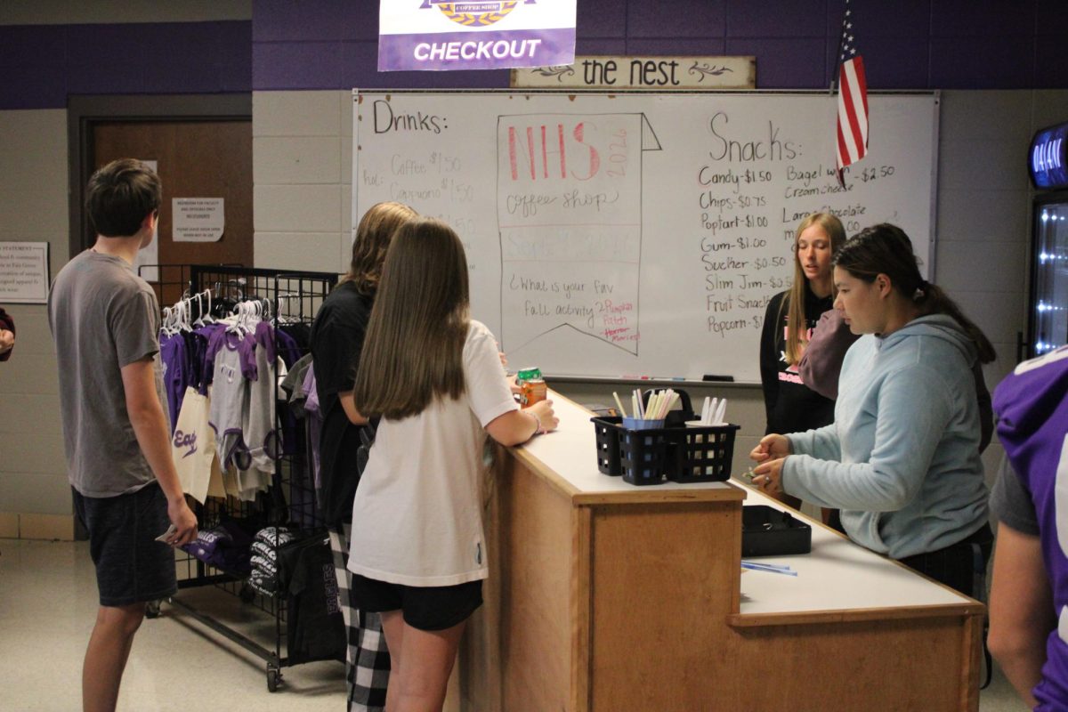 NHS members working in the coffee shop during advisory to support school activities. Featured in this photo (from left to right) is, Willow Buescher (12) and June Chumbley (12).