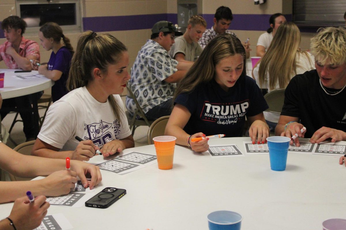 Students playing bingo at the SADD kickoff after the 9/12 home football game against Buffalo.The kickoff was hosted in the school gym and gym lobby.
Students in the photo from left to right: Aubrie Voorhis (11), Leila Huff (12), and Carson Trussel (12).