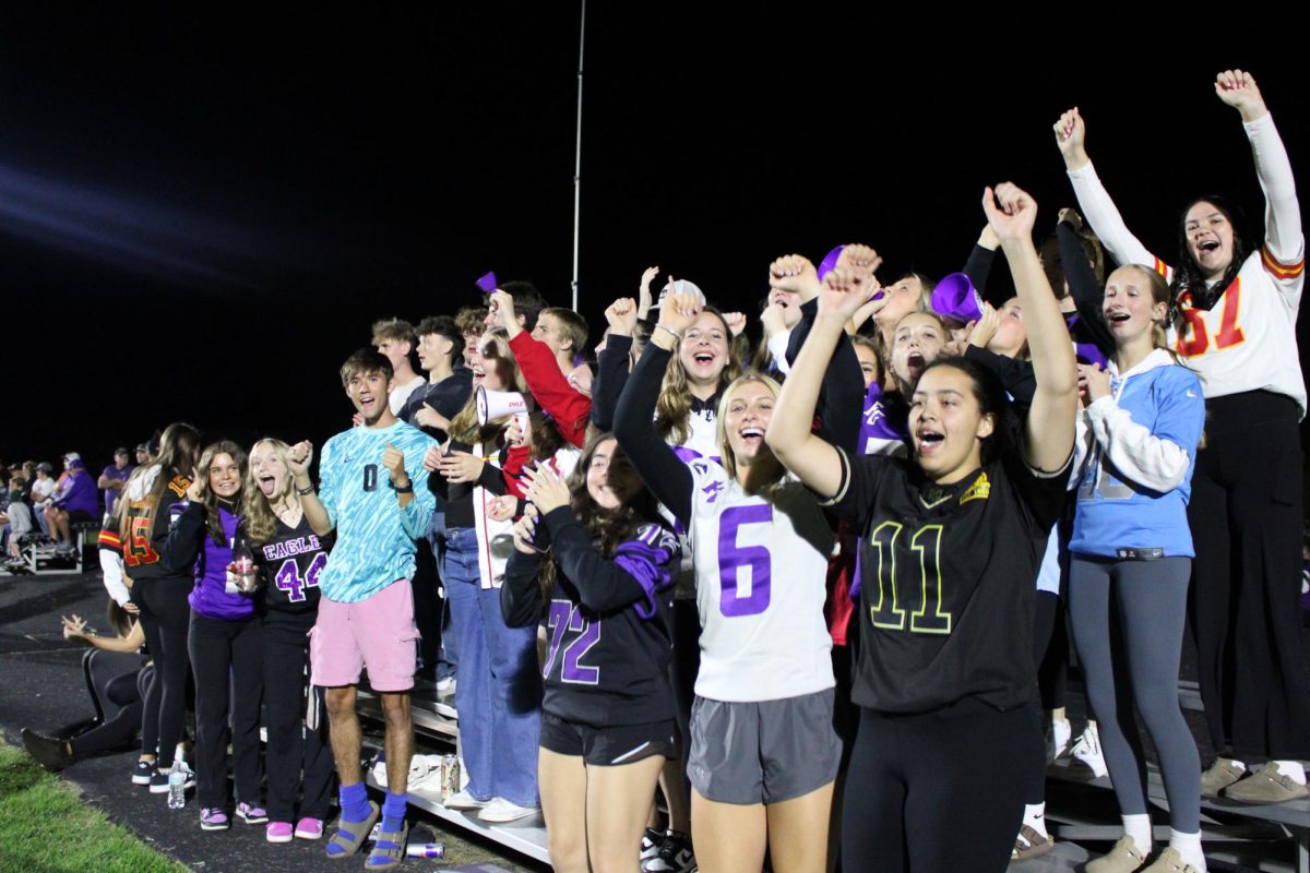 The pep club cheering at the 10/17 home football game against Forsyth. 
Front row left to right: Charli Stokes (10), Isabel Bruner (10), Wes Hart (12), Hali Stokes (12), and Aislynn Starks (12).
Second row left to right: Kenna Fishback (12) and Kathryn Knaup (9)
Third row: Palin Lentz (10)